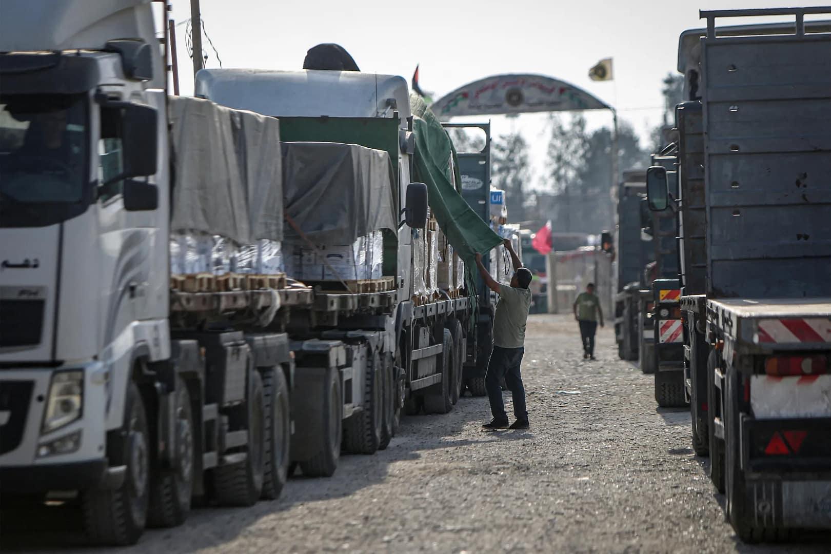 Humanitarian Aid Trucks Await Entry into Gaza Amid Ongoing Conflict